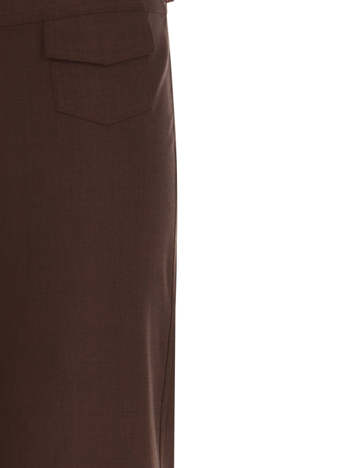 Close-up of the back pocket detail on high-waisted brown relaxed-fit pants, displayed on a white background.