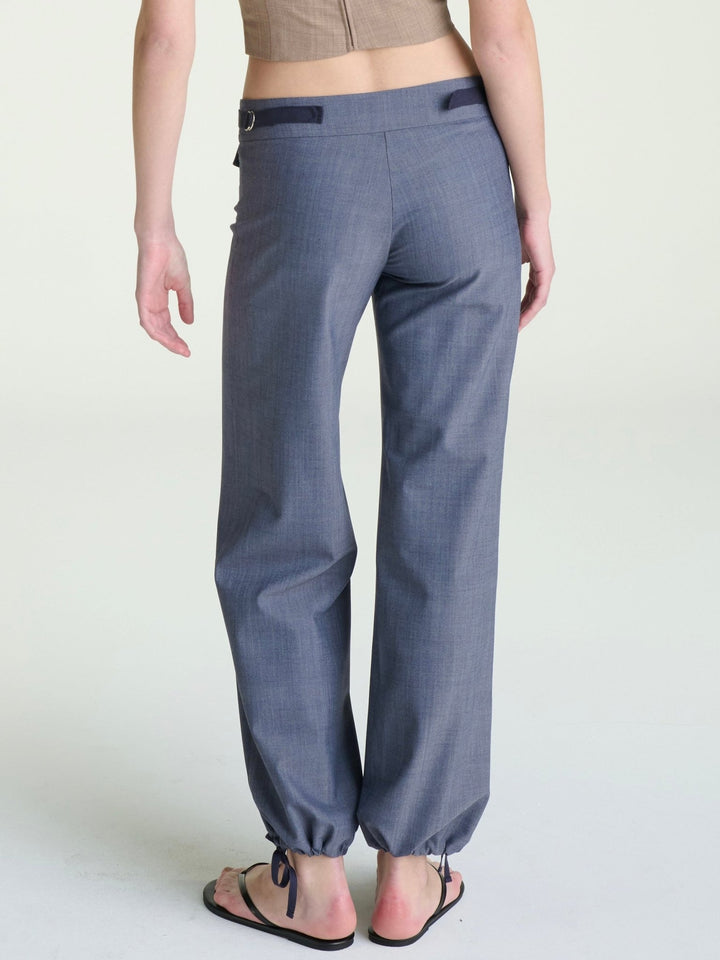 model wearing fitted blue heather pants with tie drawstrings at the ankle