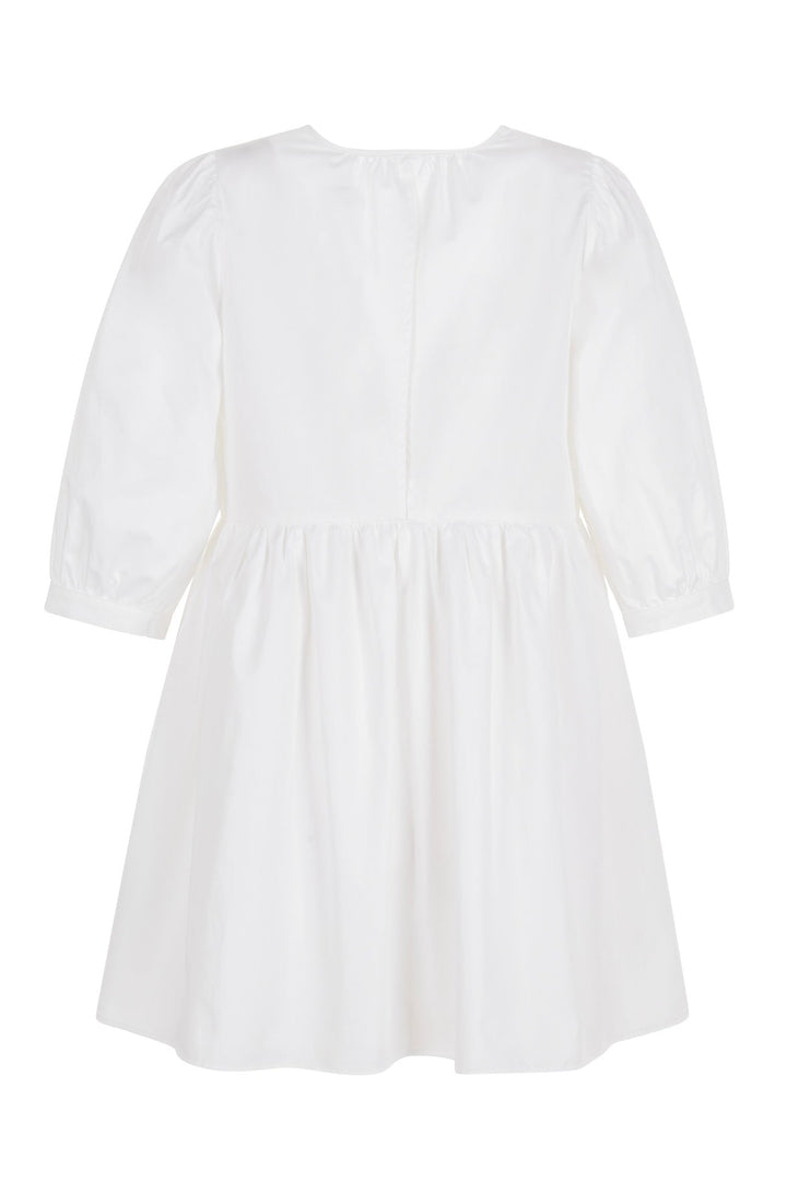 Back view of white mini dress with a deep V-neckline and three-quarter length puff sleeves displayed on a white background.