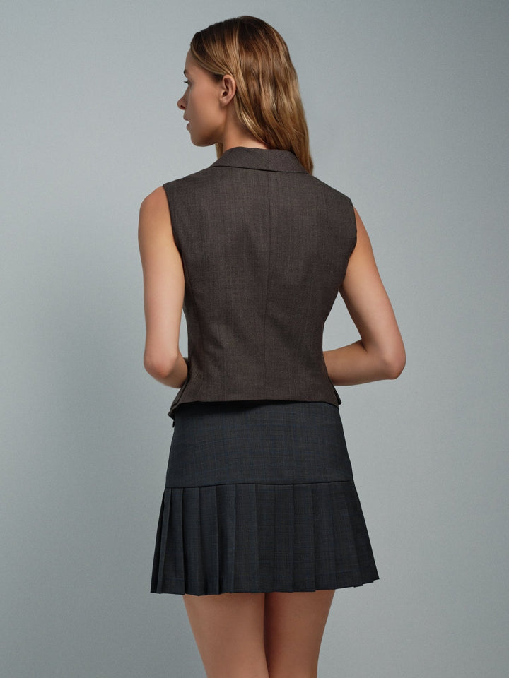 Back on-model view of the Darling waistcoat in charcoal, tailored sleeveless vest.