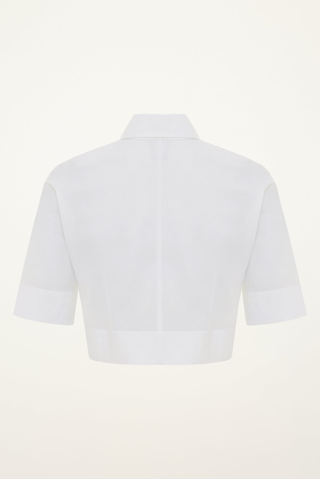 White short-sleeve cotton button-down cropepd shirt on a light gray background