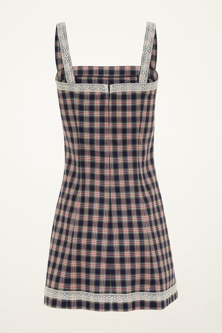 Red and navy plaid check dress with cream lace trim on a grey background