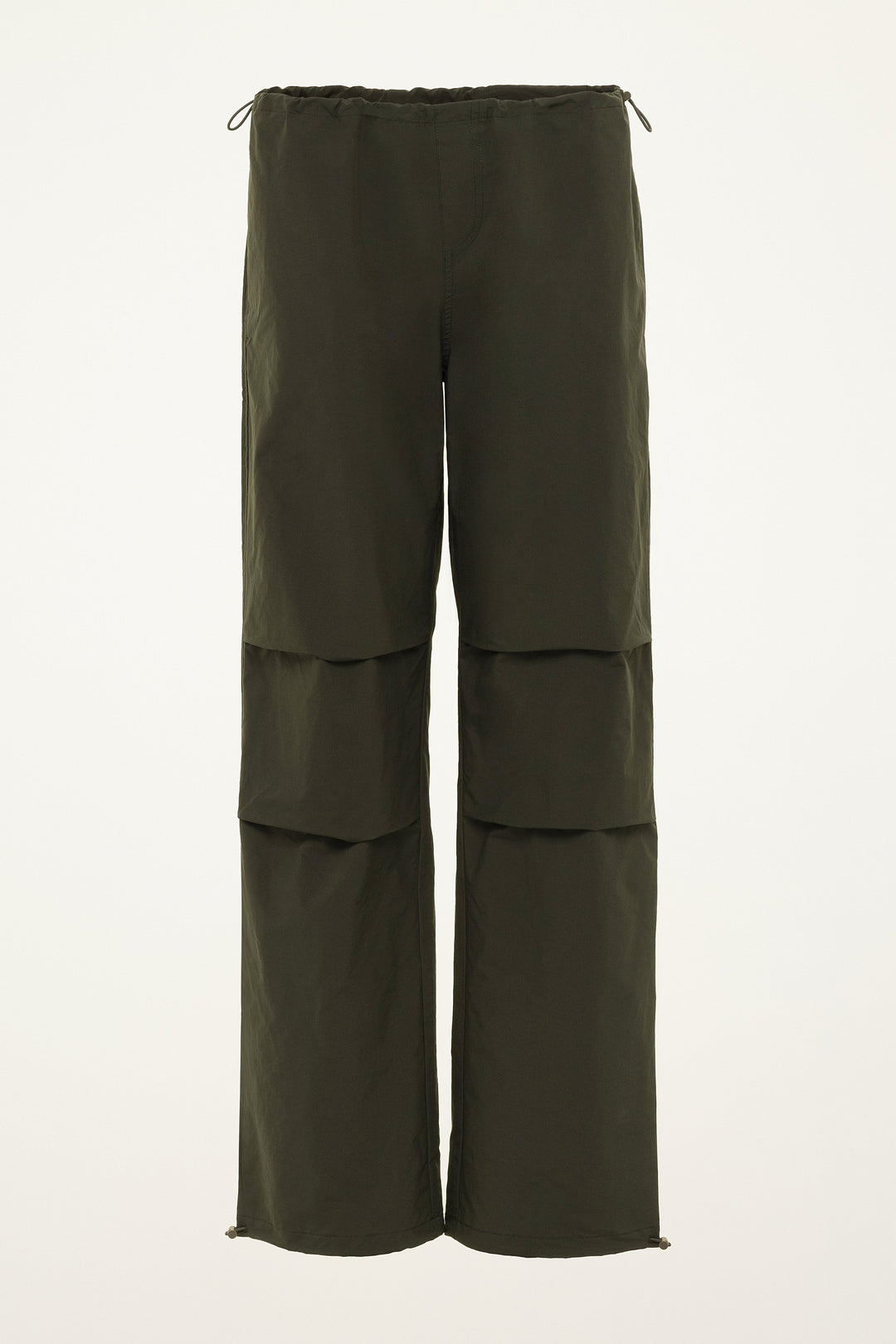 Green layered pants on a white background