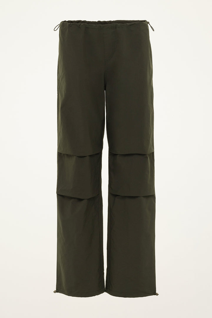 Green layered pants on a white background