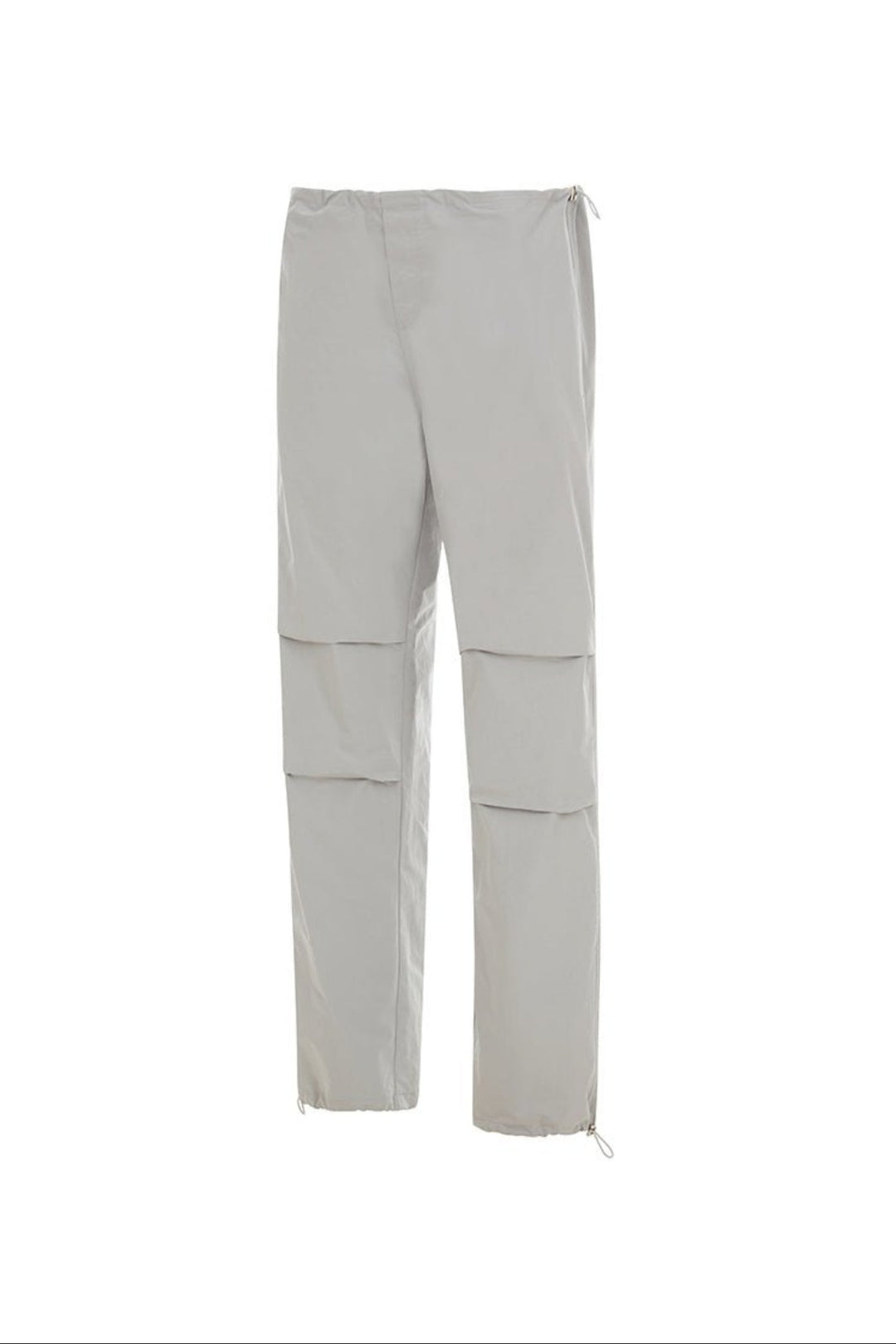 Side view of light grey pants on a white background.