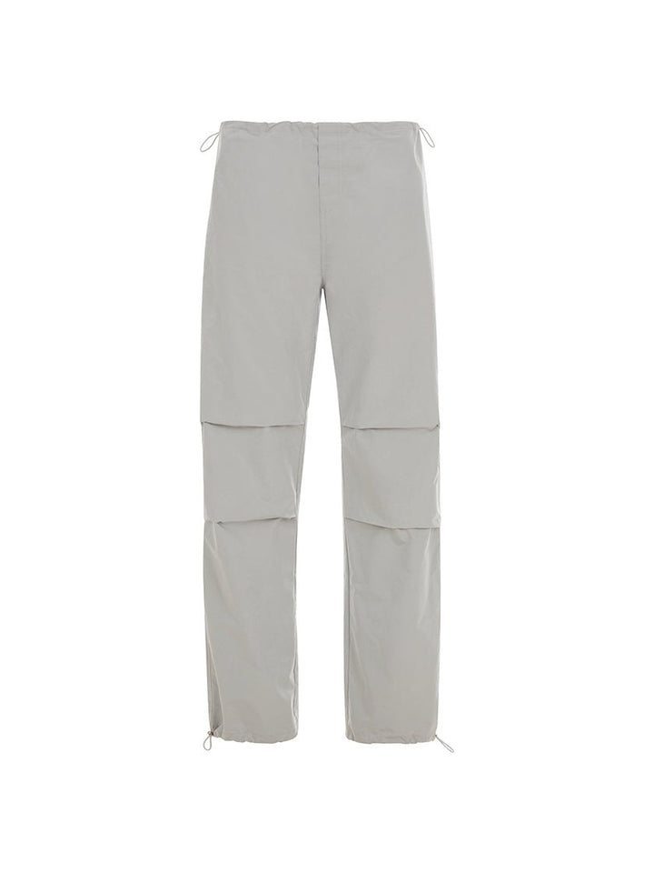 Front view of light grey pants on a white background.