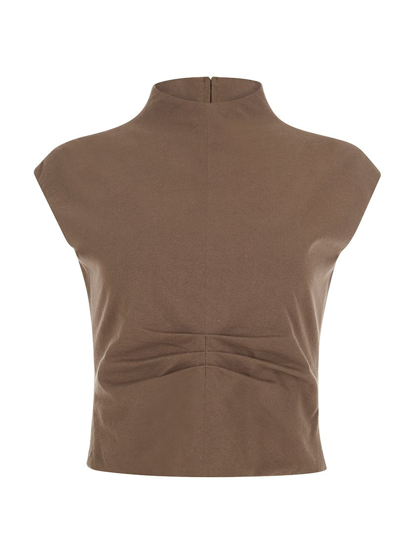 Clay sleeveless crop top with a high neckline and ruched detailing at the waist, displayed on a white background.