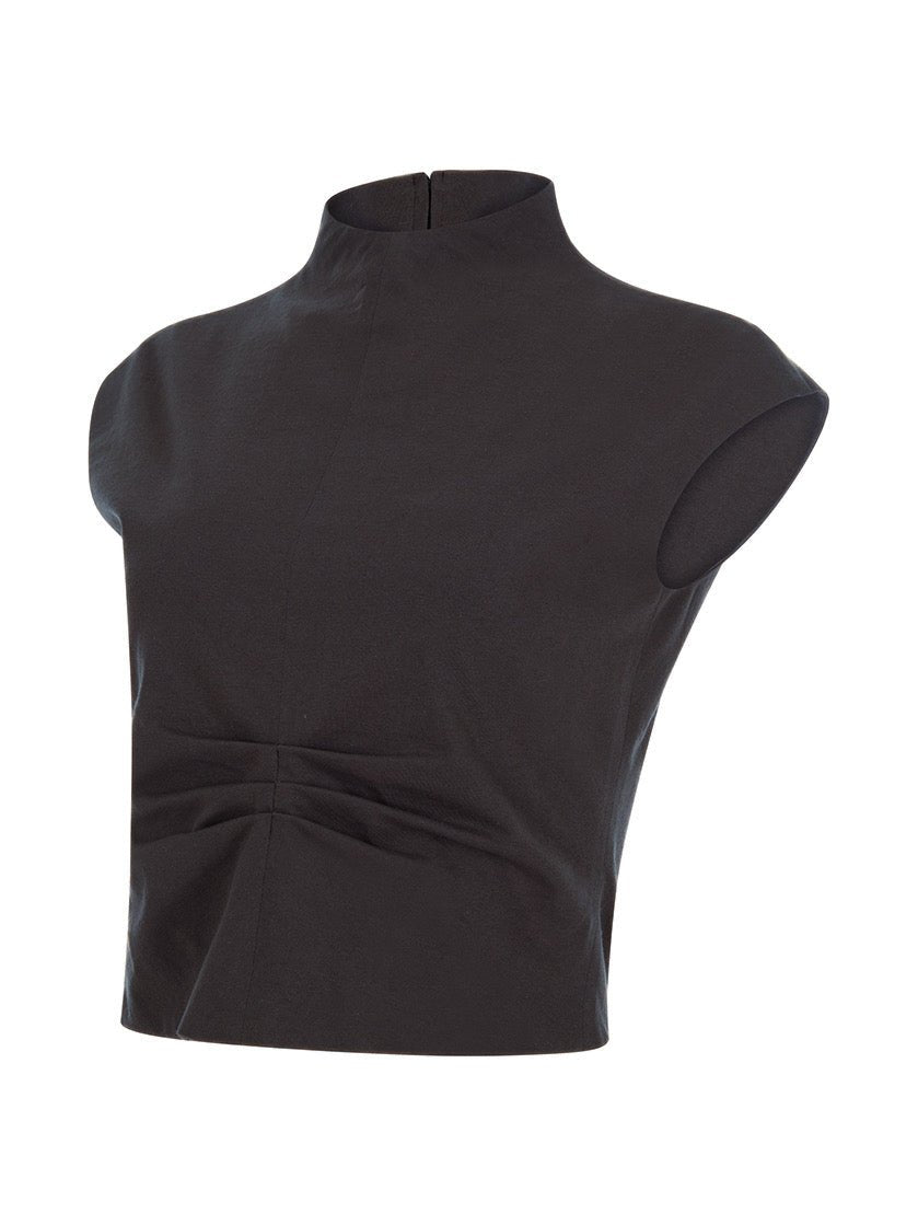 Side view of a black sleeveless crop top with a high neckline and ruched detailing at the waist, displayed on a white background.