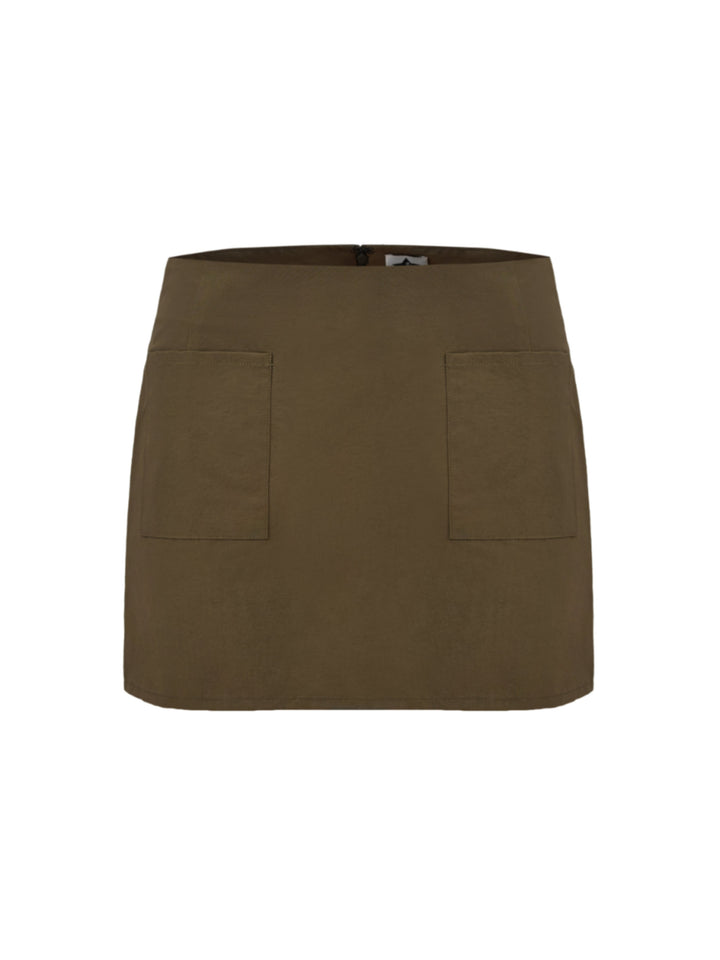 moss green skirt with two front pockets on a grey background