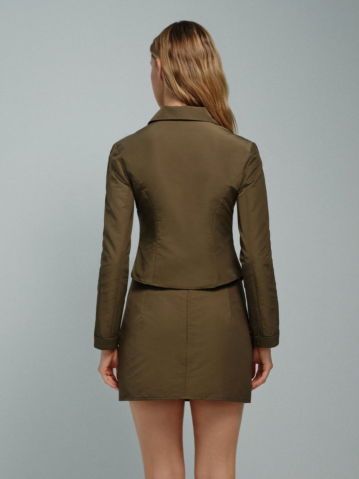 Women’s olive slim zip jacket, waist-length, back view.