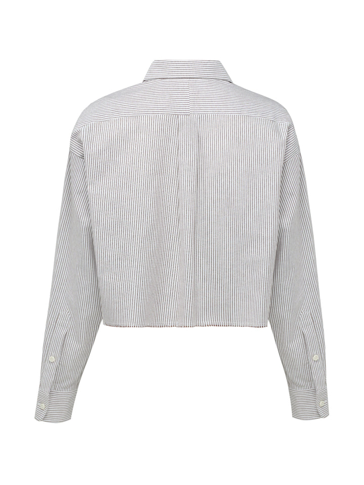 Gray and white striped shirt on a grey background
