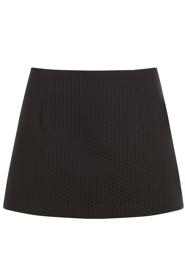 Classic black mini skirt with a textured fabric. It's showcased against a plain background.