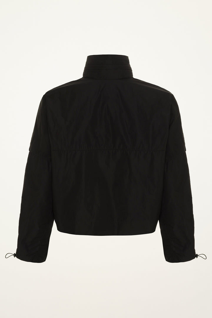 Black nylon wind and rain jacket with a high collar and drawstring sleeves on a grey background