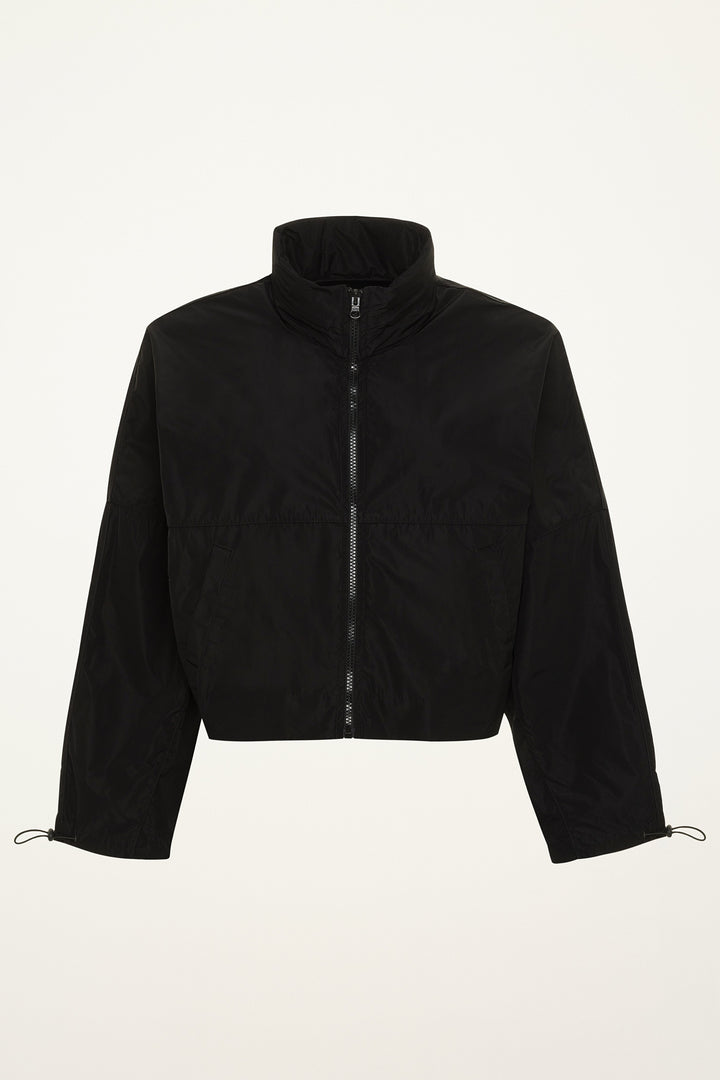 Black windbreaker rain jacket on a grey background